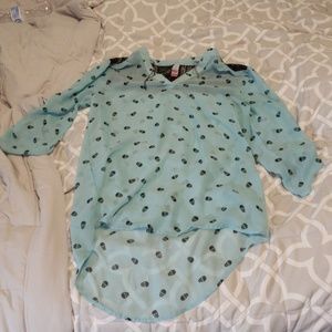 Teal shirt with black skulls and lace
